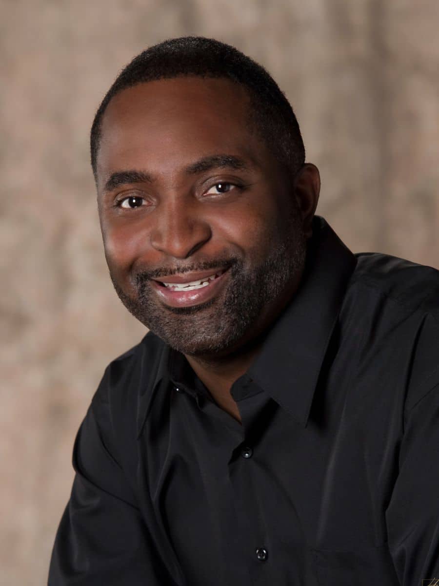 Young man smiling confidently after cosmetic bonding treatment in chesapeake va.