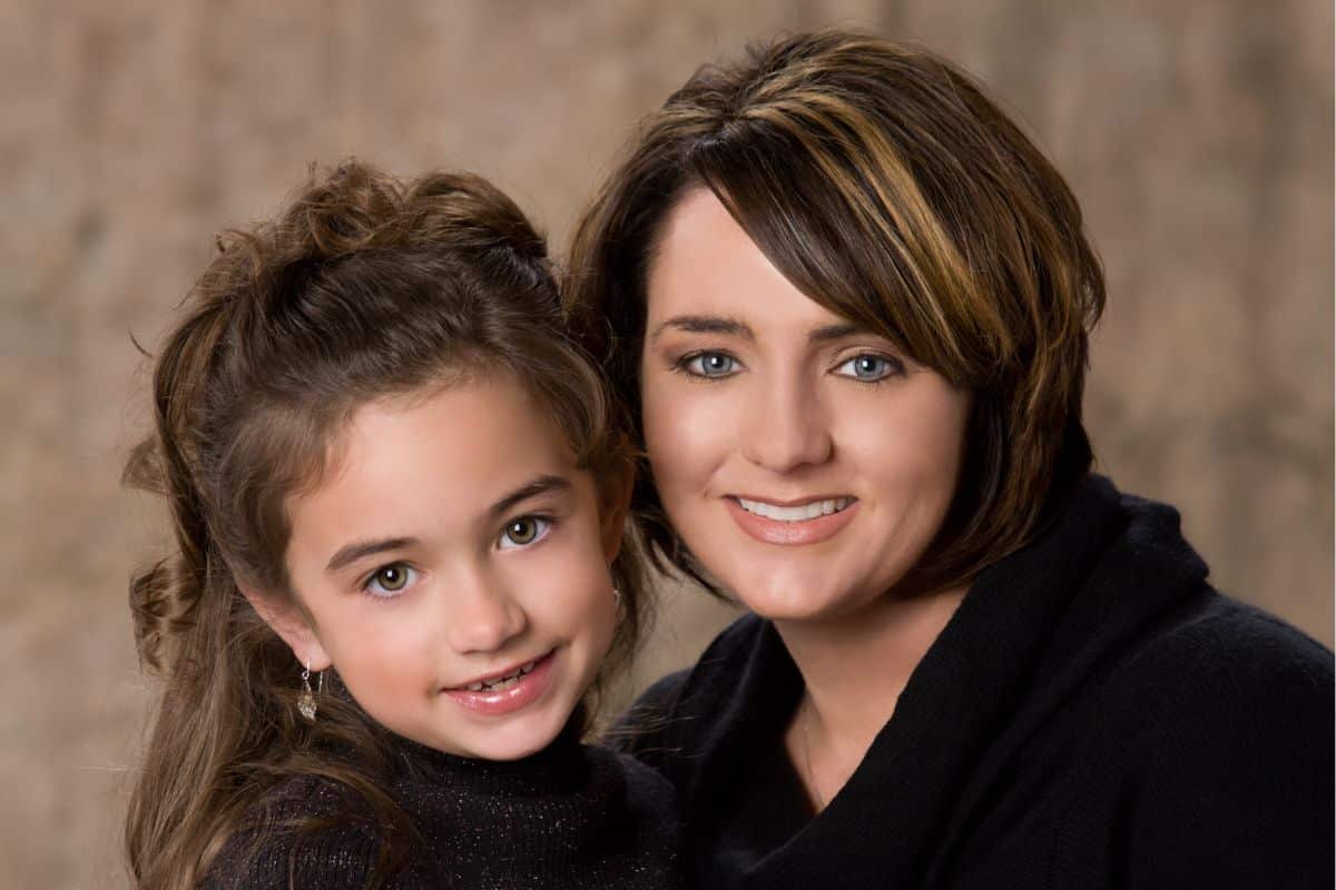 Mother and daughter smiling together after dental exam in chesapeake va.