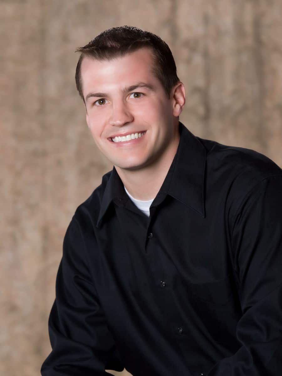 Young man smiling confidently at a dental hygiene appointment in chesapeake va.