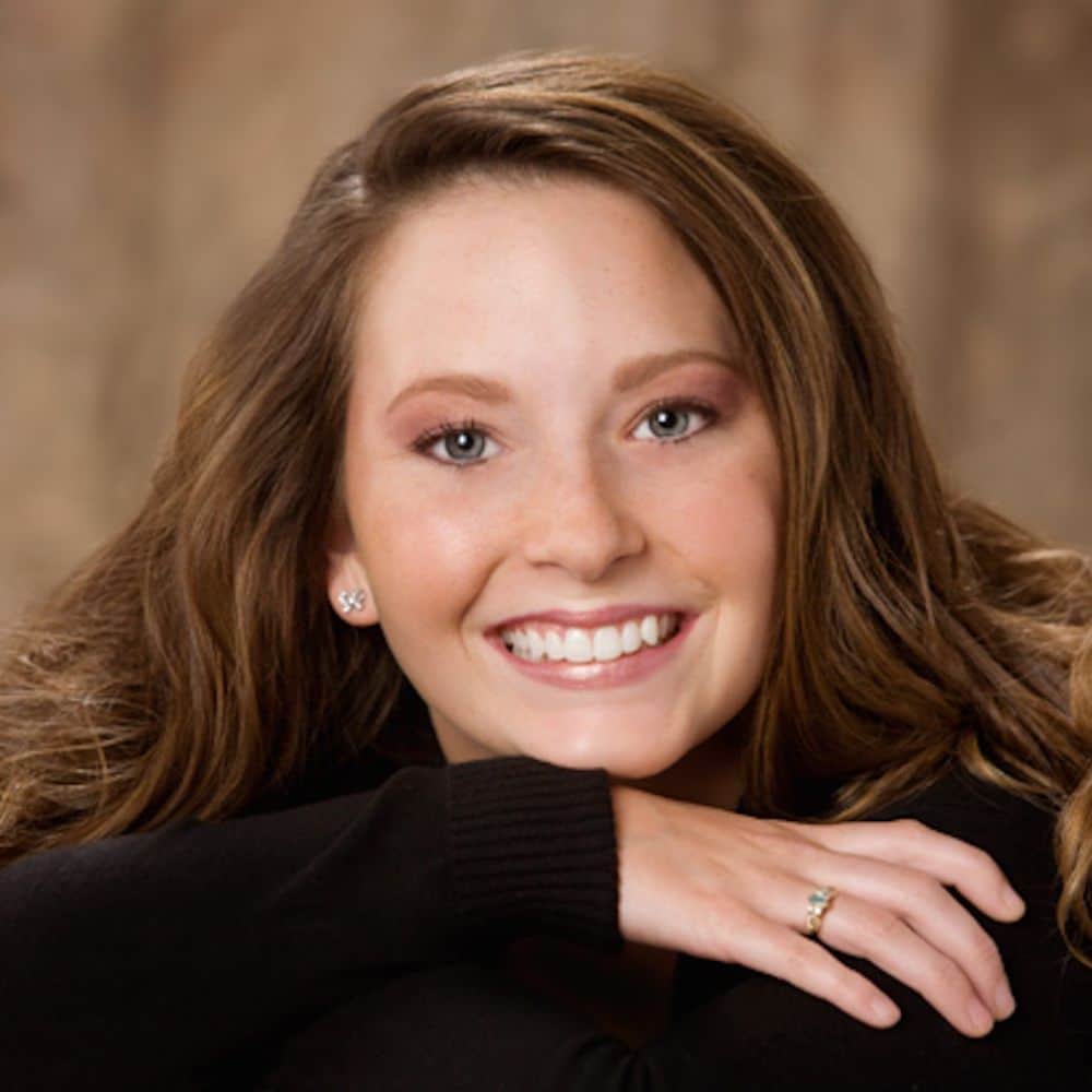 : young girl smiling confidently after invisalign treatment in chesapeake va.