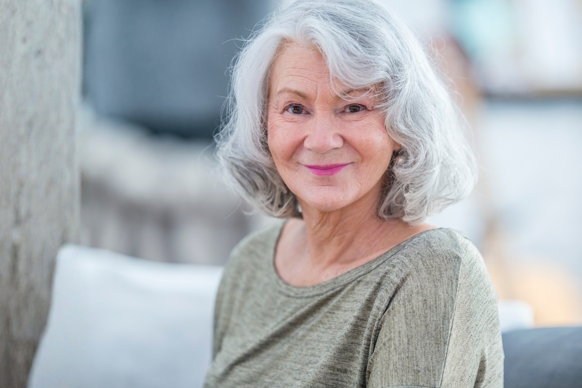 Smiling woman representing patient education and preventive dental care at the center for cosmetic and restorative dentistry in chesapeake, va.