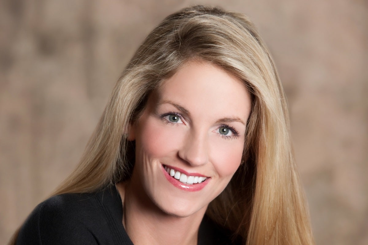 Smiling woman showing natural, bright results after porcelain veneers treatment in chesapeake, va.