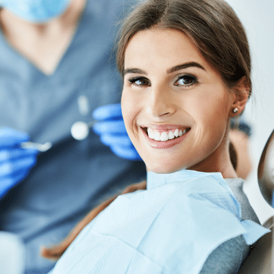 Woman smiling at the dentist, representing restorative dentistry in chesapeake va
