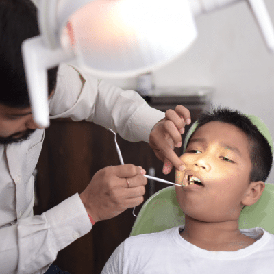 Young boy getting teeth work done at the dentist, representing general dentistry in chesapeake va