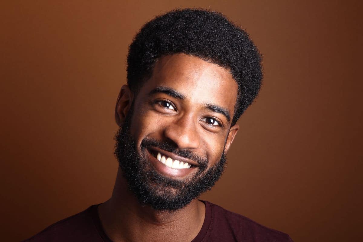 Young man smiling after teeth whitening at the center for cosmetic and restorative dentistry in chesapeake, va