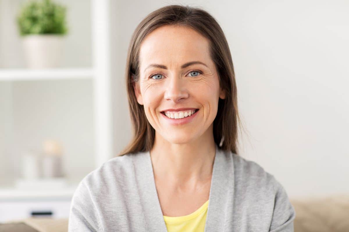 Woman smiling after tooth-colored restoration at the center for cosmetic and restorative dentistry in chesapeake, va