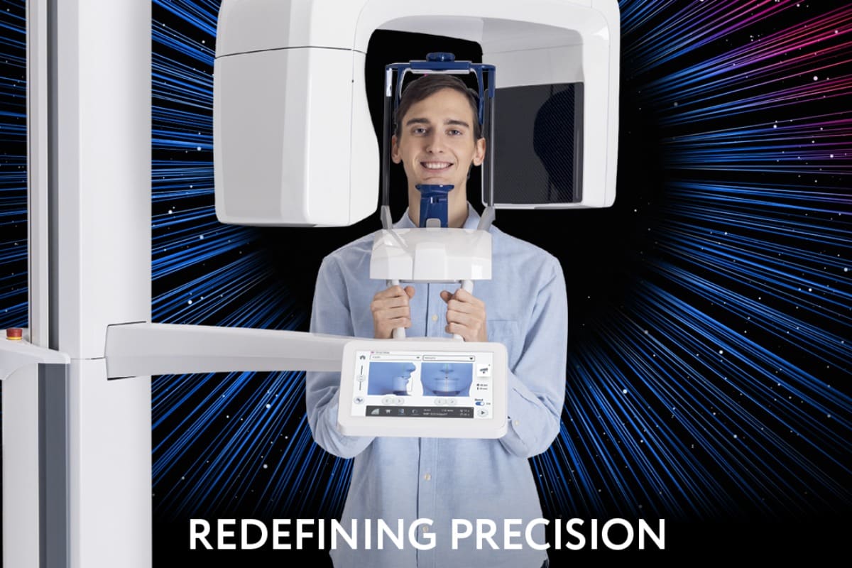 Patient standing in a Planmeca Viso G1 3D imaging scanner used for high-precision dental diagnostics.