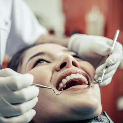 Patient receiving dental examination and care, representing how sedation dentistry works
