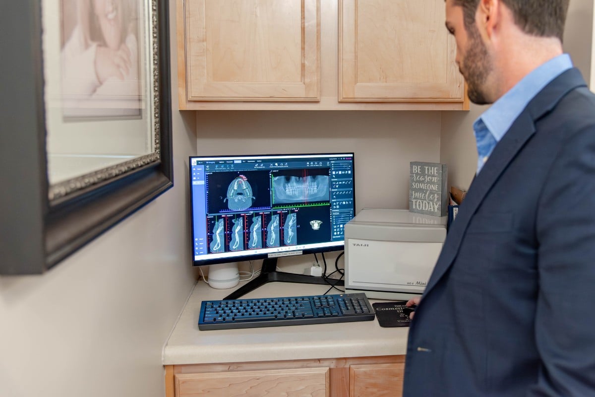 Patient discussing dental exam results with an expert dental team in chesapeake, virginia.